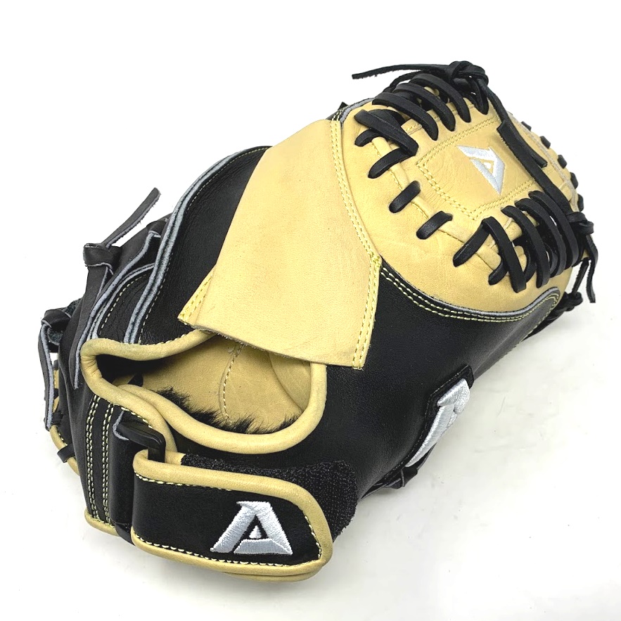 The Akadema Pro APM41 Precision 33 inch catcher's mitt is a top-of-the-line baseball glove designed specifically for catchers. With a 33 circumference and open back, this mitt is perfectly sized to accommodate the needs of catchers. The mitt features the patented Praying Mantis pattern, which includes a unique shape that allows the throwing hand to access the pocket more quickly, resulting in faster times to second base. One of the standout features of this glove is the Stress Wedge technology, which is located between the index finger and thumb. This technology offers shock-absorbing protection to the hand against injury and sting when receiving the ball, making it easier to catch fast pitches without feeling the impact. The glove also has two additional Finger Hammocks, which allow the fingers to be securely positioned inside the glove, increasing stability and control. The Akadema Pro APM41 Precision mitt has an open back and medium pocket, making it easier to retrieve the ball quickly and transfer it to the throwing hand. The Spiral-Lock web and double-sided slim padding provide increased pocket size and easier ball retention, making it easier to catch the ball and keep it in the glove. The glove's uniquely designed shape allows the throwing hand easier access into the pocket, resulting in a quicker glove-to-hand transfer and faster times to second base. Additionally, the Double Flexhinge makes the glove snap closed on contact, ensuring that the ball stays securely inside.
