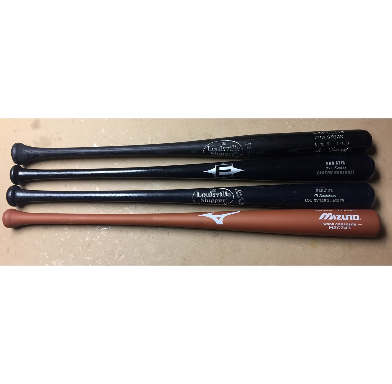 Mizuno composite, Easton Pro Stix, and Louisville Slugger wood bats in 34 inch.