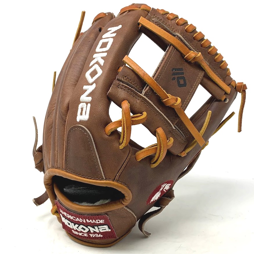           The Nokona 11.5 I Web baseball glove for infield is a remarkable glove that embodies the craftsmanship and heritage of Nokona, a brand renowned for producing top-quality ball gloves in America for over 85 years. This glove is designed specifically for infielders who seek excellence in their defensive game. The 11.5 size pattern is a popular choice among infielders, providing them with a perfect balance between glove size and agility. It allows for quick transfers and lightning-fast ball handling, enabling infielders to make those crucial split-second plays with ease. One of the standout features of the Nokona 11.5 I Web glove is its I Web design. The I Web is a highly sought-after web style for infielders due to its versatility and ability to secure the ball. The intricate web pattern helps infielders track the ball's trajectory while allowing them to see through the webbing during catches, ensuring maximum control and visibility on the field. Constructed with Nokona's proprietary Walnut Crunch™ leather, this glove offers exceptional stability, durability, and a game-ready feel. The Walnut Crunch leather is a signature material that has been perfected by Nokona over the years. It provides a unique blend of flexibility and rigidity, allowing the glove to maintain its shape and integrity even after extensive use. This ensures that the glove retains its high-performance qualities throughout its lifespan. The classic Walnut™ series has been updated to incorporate modern features while paying homage to Nokona's rich baseball and softball legacy. This combination of tradition and innovation results in a glove that is not only functional but also visually appealing, embodying the timeless spirit of the game. Weighing approximately 620g, this glove strikes a perfect balance between weight and performance. It offers enough heft to feel substantial in the hand while remaining light enough to facilitate quick movements and reactions on the field. Nokona takes great pride in the craftsmanship of their gloves, and the Nokona 11.5 I Web is no exception. Handcrafted with meticulous attention to detail, this glove is a testament to the skill and dedication of the artisans behind its creation. Every stitch, cut, and contour is meticulously executed to ensure the highest quality and performance. To further enhance customer satisfaction, Nokona offers a one-year warranty on this glove. This warranty provides peace of mind to players, knowing that their investment is protected against any potential defects or issues. In conclusion, the Nokona 11.5 I Web baseball glove for infield is a remarkable piece of equipment that embodies Nokona's rich history and commitment to quality. With its 11.5 size pattern, I Web design, Walnut Crunch leather, and handcrafted construction, this glove offers infielders exceptional stability, durability, and performance. Whether you're a professional player or a passionate amateur, the Nokona 11.5 I Web glove is a worthy companion on the field, allowing you to elevate your defensive game with confidence.              