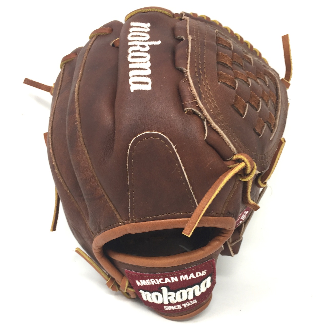 Made in USA    Nokona Classic Walnut Youth Baseball Glove. 10.5 inch with closed basket web. Open Back. Red old school wrist patch. Finger Pad. American Flag. Make in Nokona, TX. This glove is for players under 12 that still want the same high quality Nokona walnut crunch leather used in the adult gloves.
