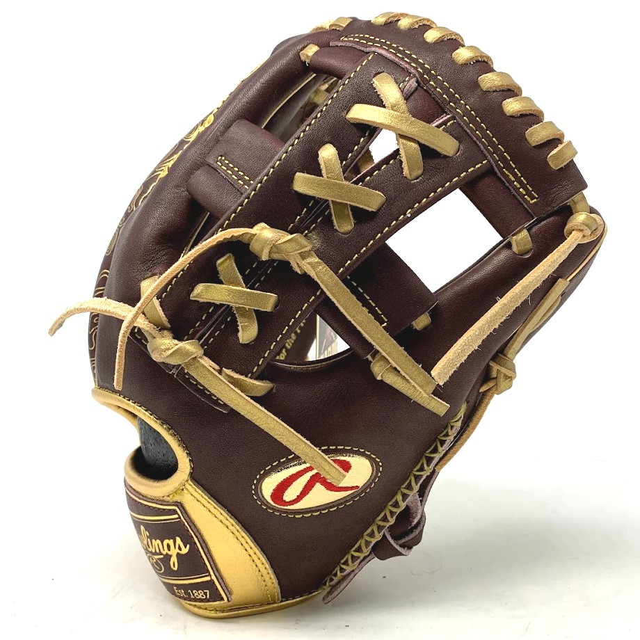 Introducing the 7th generation of the Rawlings Gold Glove Club exclusive Goldy gloves, a pinnacle of craftsmanship and performance designed specifically for infielders. This 11 ¾ glove is meticulously constructed using Rawlings' world-renowned Heart of the Hide® leather, known for its exceptional durability, flexibility, and superior feel. With its classic design and modern enhancements, this glove is a true testament to Rawlings' commitment to excellence. The Split Single Post web is a standout feature, offering increased stability and ensuring the ball is securely held in the web, preventing any unexpected bounces or slips. This web design provides infielders with the confidence to make quick and precise transfers, enabling them to turn smooth and seamless double plays. The Goldy glove is a reflection of the highest standards of quality and attention to detail. Each glove is handcrafted to perfection, ensuring a consistent and reliable performance on the field. The meticulous construction, combined with the premium Heart of the Hide® leather, results in a glove that is not only durable but also molds to the player's hand over time, creating a personalized fit that enhances control and comfort.        Whether you're a professional infielder seeking the ultimate tool to elevate your game or an avid baseball enthusiast passionate about the sport, the Rawlings Goldy glove is the pinnacle of excellence. It represents the culmination of Rawlings' rich heritage and unwavering commitment to producing top-of-the-line baseball gloves trusted by the best players in the world. Step onto the field with confidence, knowing you have a glove that exemplifies excellence and is ready to perform at the highest level. In addition to its exceptional features, the Rawlings Goldy glove boasts unique gold accents that add a touch of elegance and style. These eye-catching gold accents are prominently displayed on the finger backs of the glove, making a bold statement on the field. The shimmering gold details not only enhance the glove's visual appeal but also serve as a testament to its exclusivity and prestige. Furthermore, the glove proudly showcases a sherry and gold embossed patch logo. This distinctive logo adds a sophisticated and refined touch to the overall design, further emphasizing the glove's exclusivity as a member of the Rawlings Gold Glove Club. The meticulously crafted logo serves as a symbol of quality and craftsmanship, signifying the dedication and attention to detail that goes into creating each Goldy glove. With its unparalleled performance, premium materials, and exquisite design elements, the Rawlings Goldy glove sets a new standard for excellence in the world of baseball. This glove is not only a top-tier tool for infielders but also a statement piece that exudes style and sophistication. Elevate your game with a glove that combines functionality, durability, and a touch of luxury—a glove that truly embodies the spirit of the Gold Glove Club.