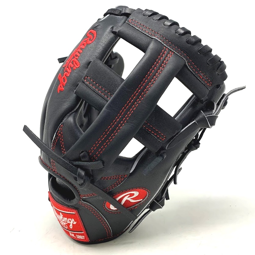 The Rawlings Black Heart of the Hide PROTT2 baseball glove, exclusively available at ballgloves.com, is an exceptional baseball glove for any serious baseball player or ball player wanting to add to their collection. This 11.5-inch glove features a sleek black design, highlighted by a striking red stitch on the black heart of the hide leather. The single post web and grey split welt contribute to the glove's individuality and give it a timeless, classic look. The Black Horween Heart of the Hide leather used to create this glove is renowned for its exceptional quality and durability, ensuring that this glove will withstand the rigors of the game and last for years to come. The traditional Rawlings red patch on the back of the glove adds a touch of authenticity and serves as a mark of quality.   