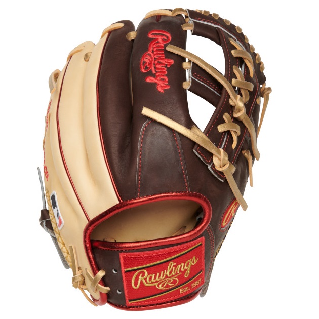 Introducing the latest addition to the game's lineup: the Rawlings ColorSync 7.0 Heart of the Hide PRO205-32CCH baseball glove. Crafted with the utmost attention to detail, this 11.75-inch infield glove features hand-sewn welting, a signature of top-tier gloves worldwide. The sleek brown-and-camel color scheme is elevated with hints of gold and red, adding a touch of sophistication. The glove is built to deliver results on the field, with its 200 pattern and Heart of the Hide leather, trusted by professional players for decades. The split-single post web is also gaining popularity among big-name stars like Francisco Lindor. Known for its seamless combination of style and functionality, the ColorSync series sets the standard for performance-enhancing gear, and this glove exemplifies why.      Web: Split Single Post Size: 11.75 Inch      