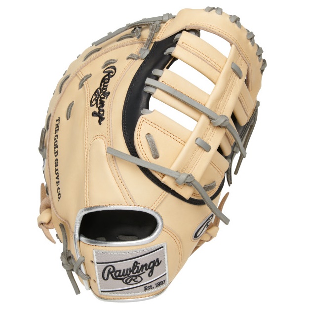 Unleash your skills on the field with the PRORFM18-10BC Heart of the Hide R2G 12.5-inch First Base Mitt. This exceptional mitt is ready to go straight from the box. Meticulously crafted from ultra-premium steer-hide leather, it offers unrivaled quality and durability. With an additional 25% factory break-in, this mitt provides a game-ready feel right out of the gate. Experience a quicker break-in period, allowing you to focus more on the game and less on breaking in your glove. Comfort is paramount, and this Heart of the Hide first base mitt delivers. It features a leather palm lining, ensuring a luxurious feel against your hand. The thermoformed wrist strap and padded thumb sleeve provide superior comfort and support. We've also enhanced the heel pad design on all R2G gloves, promoting an easier and more secure closure. Constructed in a 12.5-inch FM18 pattern, this mitt showcases a timeless black and camel color scheme, complemented by eye-catching silver accents. Not only will you be able to scoop more balls effortlessly, but you'll also look fantastic doing it. Make the Heart of the Hide R2G 12.5-inch First Base Mitt your go-to game-day companion and earn the respect of your infielders. Join the countless professionals who trust Rawlings gloves above all others. Don't miss out—get yours now!
