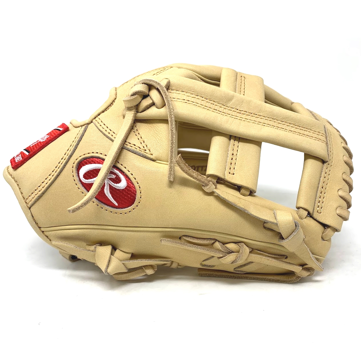 Take the field with this limited production Rawlings Heart of the Hide TT2 11.5 Inch infield glove offered by ballgloves.com and Don Morton Sports. Have a style all your own with this superior quality Rawlings ultra-premium steer-hide leather and TT2 pattern. Rawlings popular TT2 pattern offers a wide, shallow pocket allowing for quick transfers up the middle.   Pattern: TT2Sport: BaseballLeather: Heart of the HideFit: StandardThrowing Hand: Right-Hand ThrowPosition: InfieldSize: 11 1/2Web: Single PostColor: CamelLogo: PatchLaces: CamelNo Palm PadWrist Lining: Thermo FormedBreak-In: Standard