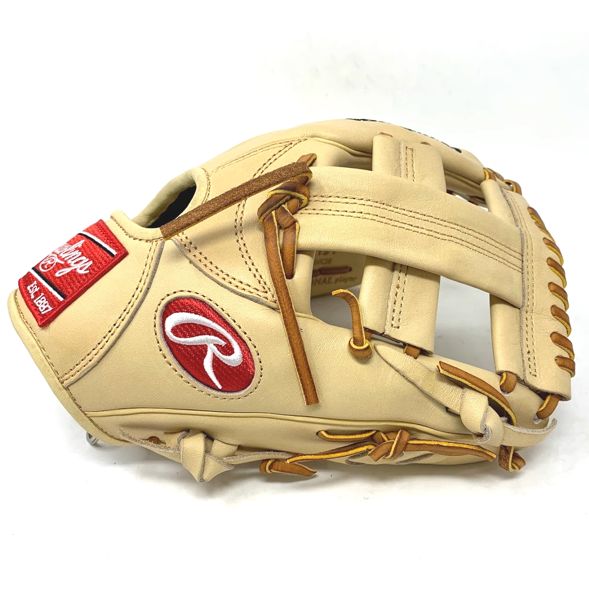 Elevate your game with the limited-edition Rawlings Heart of the Hide TT2 11.5 infield glove, exclusively available at ballgloves.com and Don Morton Sports. Made from ultra-premium steer-hide leather, this glove offers superior quality and a unique style that sets you apart on the field. The popular TT2 pattern features a wide, shallow pocket for quick transfers and a snug fit, allowing you to take control of the middle infield with confidence. Pattern: TT2Sport: BaseballLeather: Heart of the HideFit: StandardThrowing Hand: Right-Hand ThrowPosition: InfieldSize: 11 1/2Web: Single PostColor: CamelLogo: PatchLaces: TanNo Palm PadWrist Lining: Thermo FormedBreak-In: Standard