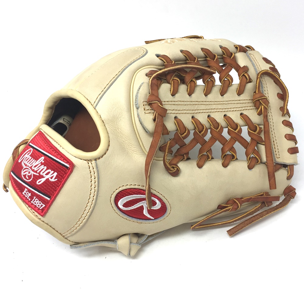 Rawlings Heart of the Hide Camel leather and brown laced. 11.5 inch Modified Trap Web and Open Back. Deer tanned cowhide lining.