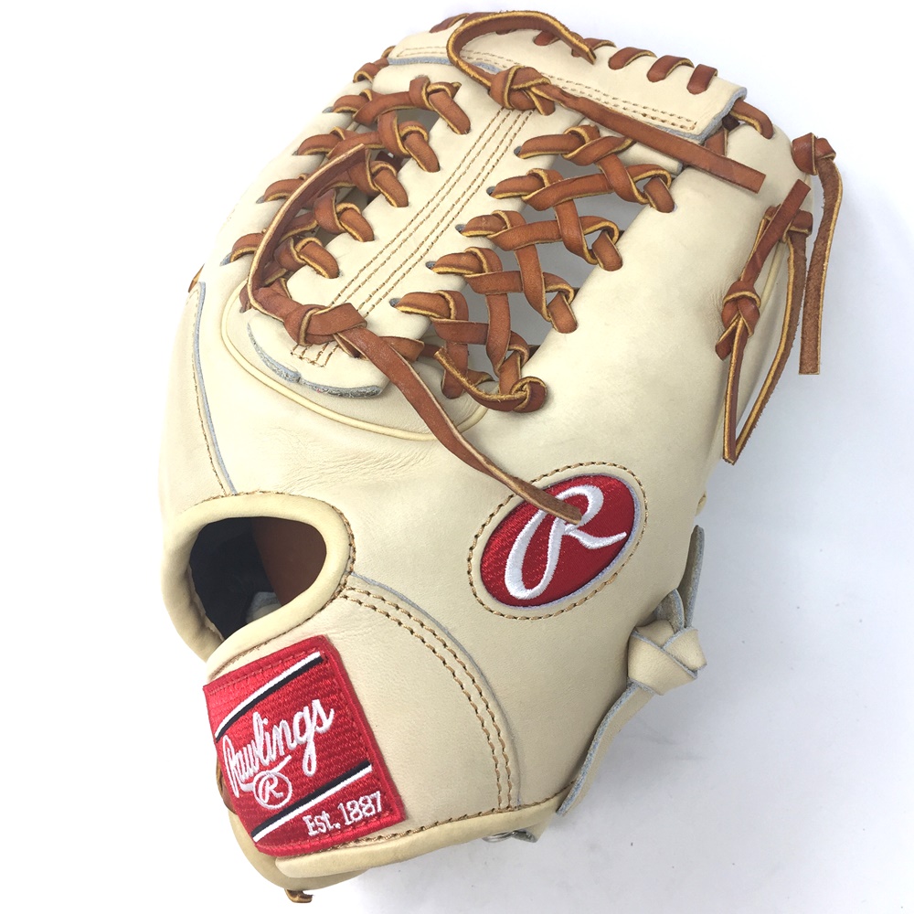 Rawlings Heart of the Hide Camel leather and brown laced. 11.5 inch Modified Trap Web and Open Back. Deer tanned cowhide lining.