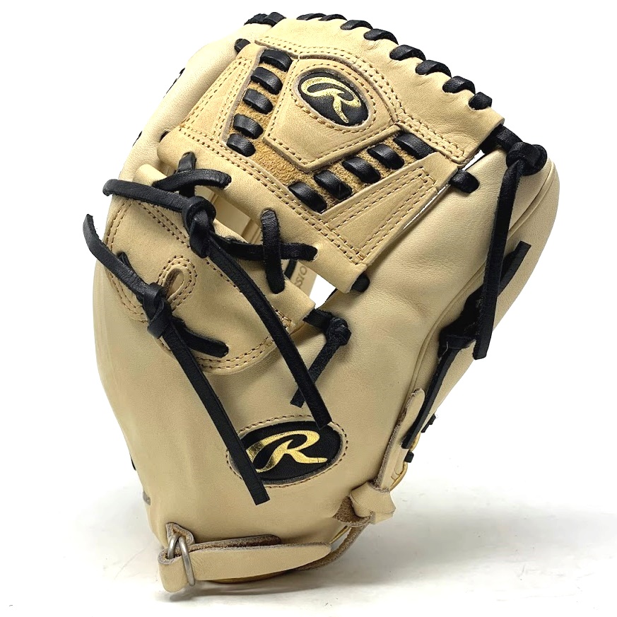  12 Inch  Closed Two Piece 30 Web Camel Shell Black Laces Fully Closed Fastback with D-Ring Closure Gold Rawlings Labels Indent Stamping Gold Binding Rolled Welt Deer Tanned Cowhide Lining       The Rawlings Pro Label 7 Camel infield/pitcher's glove is an exceptional addition to the exclusive Pro Label line. This glove boasts a closed-back shell design, offering a streamlined profile and superior control on the field. Made from Heart of the Hide leather, known for its durability and longevity, this glove is built to withstand the rigors of the game season after season. The Pro Label 7 Camel is a visually striking glove, featuring a camel and black colorway with gold accents that give it a commanding and stylish look. Additionally, it comes in a versatile 200 pattern, making it perfect for multiple positions across the diamond. The Pro Label 7 also features an ultra-rare leather Rawlings patch, which sets it apart from other gloves on the market. Each Pro Label 7 is individually crafted by the finest glove makers in the world, ensuring the utmost attention to detail and quality. When you put on this glove, you will feel the craftsmanship and dedication that goes into creating a true work of art. Don't miss out on the opportunity to own a Pro Label 7 Camel infield/pitcher's glove, get yours today!  